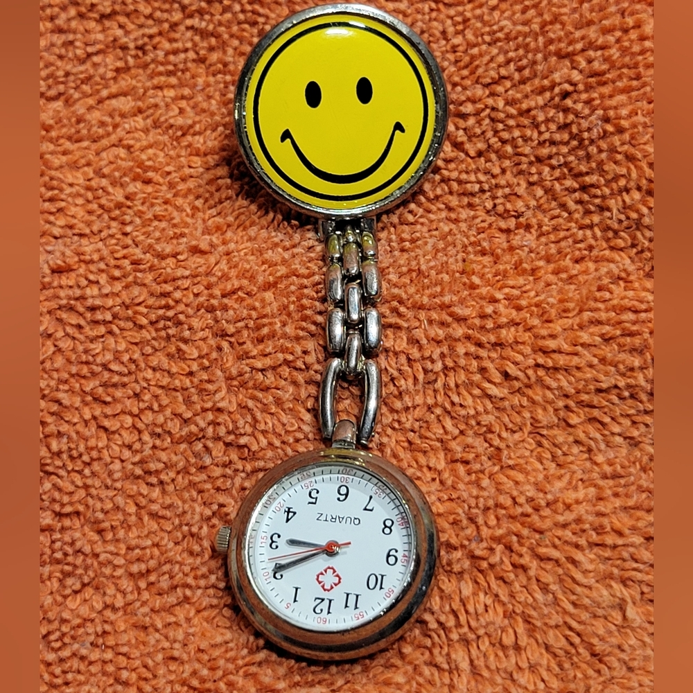 Smiley face pin on nurses watch in excellent condition.